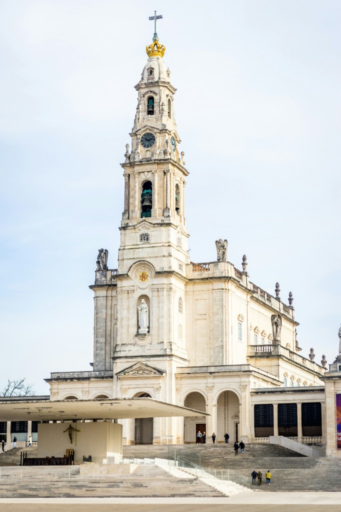 Sanctuary of Fátima basilica and plaza under a blue sky