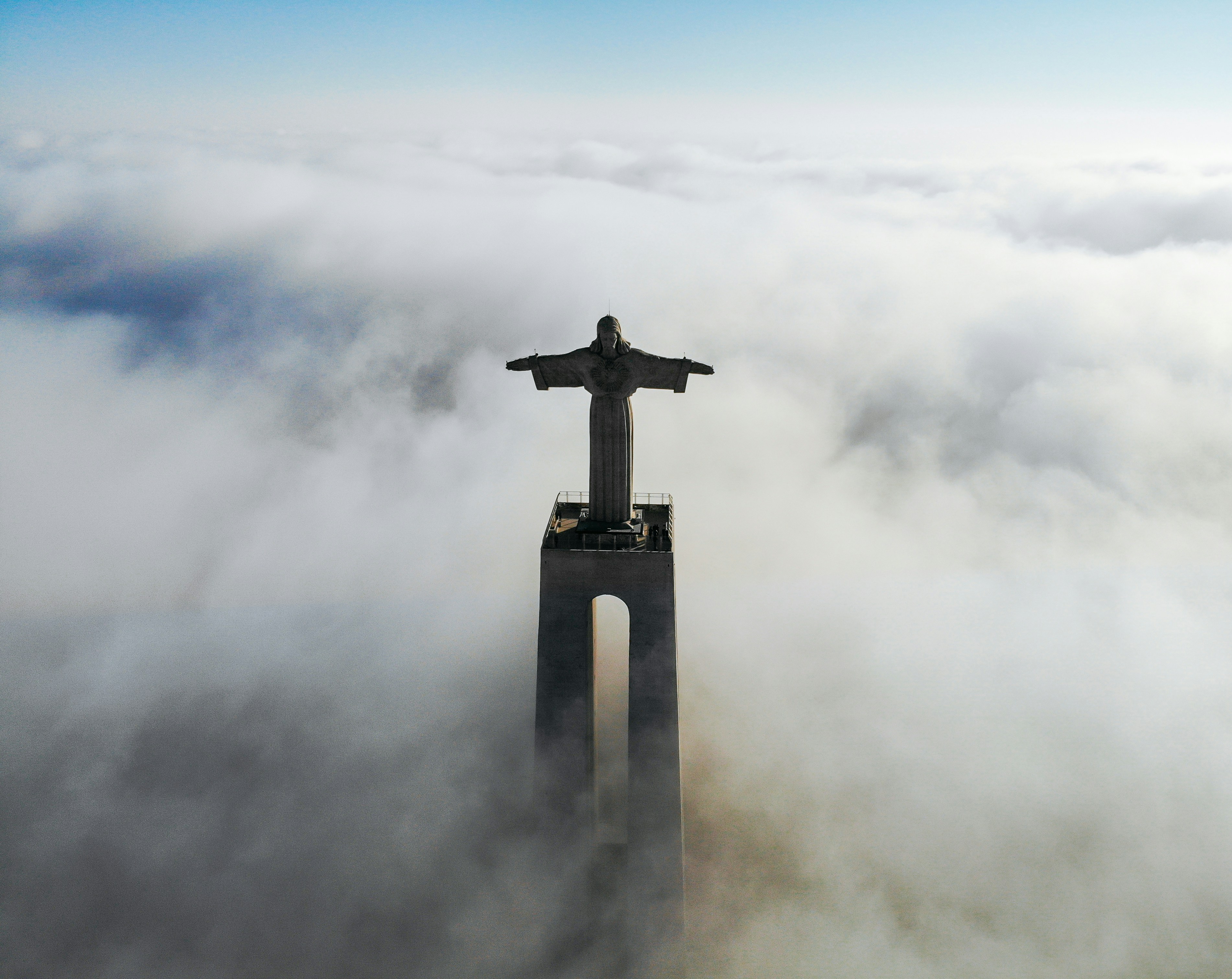 Cristo Rei monument rising above the clouds in Lisbon, Portugal