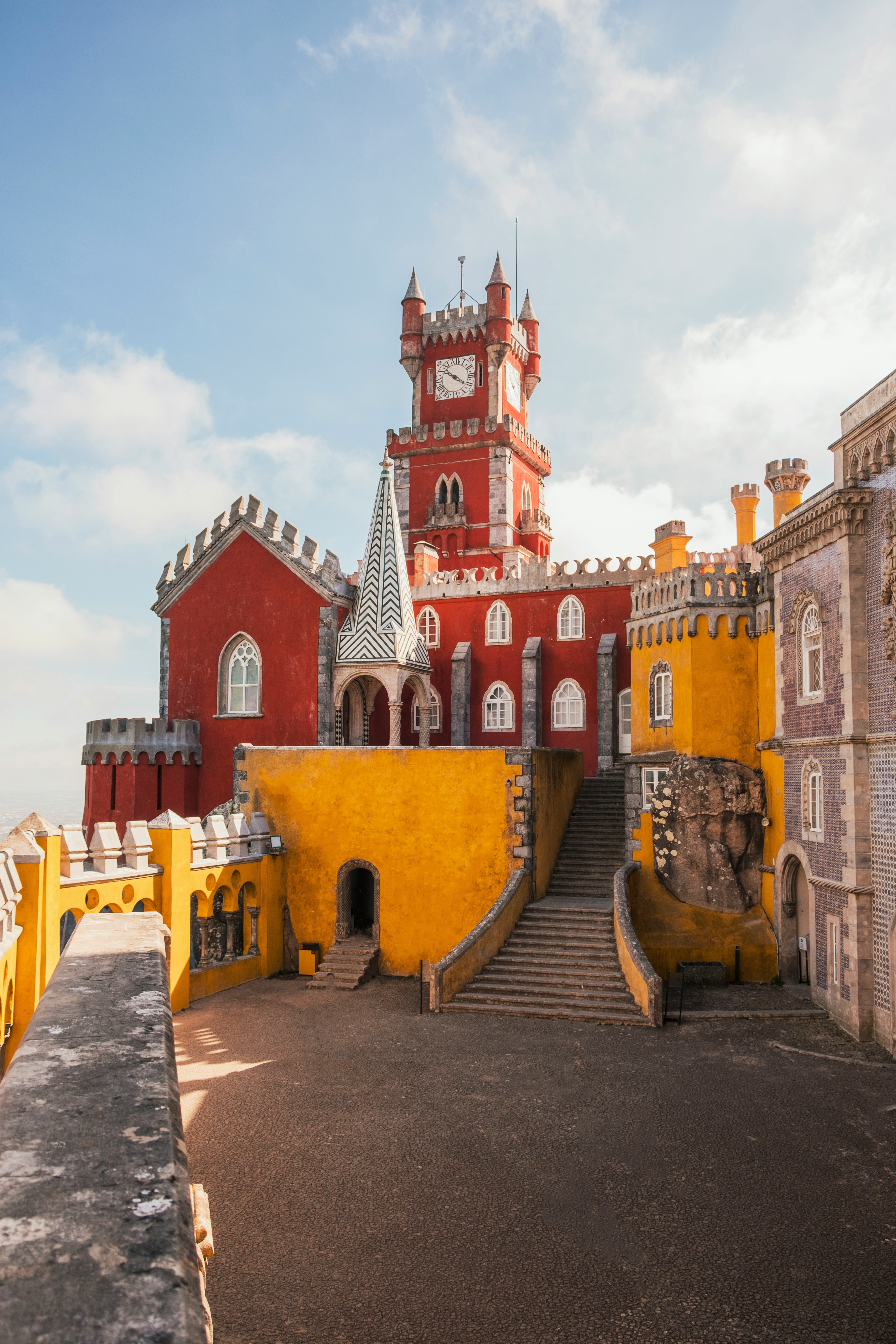 Yellow Pena Palace in Sintra surrounded by green forest